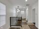 Spacious upper hallway with black railing and checkered floor at 1208 W 18Th St, Indianapolis, IN 46202