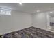 Spacious basement bedroom with new carpet and access to hallway at 1208 W 18Th St, Indianapolis, IN 46202