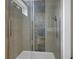 Basement shower with tiled walls and glass enclosure at 1208 W 18Th St, Indianapolis, IN 46202