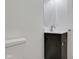 Modern bathroom features a dark vanity and updated fixtures at 1208 W 18Th St, Indianapolis, IN 46202