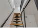 Stylish stairs with wood steps and cable railing at 1208 W 18Th St, Indianapolis, IN 46202