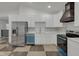 Modern kitchen with stainless steel appliances and checkered floor at 1208 W 18Th St, Indianapolis, IN 46202