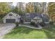 Aerial view of a house with a two-car garage and landscaped yard at 6971 Lynx Dr, Nineveh, IN 46164