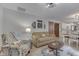 Bright living room with a comfy couch and a view into the dining area at 6971 Lynx Dr, Nineveh, IN 46164