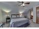 Charming bedroom with a comfortable bed and ceiling fan at 6971 Lynx Dr, Nineveh, IN 46164