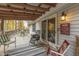 Relaxing back porch with seating and wooded view at 6971 Lynx Dr, Nineveh, IN 46164