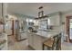 Updated kitchen with white cabinets, stainless steel appliances, and island at 6971 Lynx Dr, Nineveh, IN 46164
