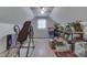 Large attic space with ample storage and a window for natural light at 6971 Lynx Dr, Nineveh, IN 46164