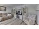 Living room with a fireplace, comfortable seating, and built-in shelving at 6971 Lynx Dr, Nineveh, IN 46164