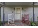 Front porch with rocking chairs and brick flooring at 6971 Lynx Dr, Nineveh, IN 46164