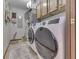 Laundry room with washer, dryer, and wood cabinets at 6971 Lynx Dr, Nineveh, IN 46164