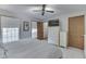 Spacious bedroom with ceiling fan, large windows, and striped bedding at 6971 Lynx Dr, Nineveh, IN 46164