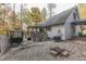 Backyard with deck, fire pit, and gravel patio at 6971 Lynx Dr, Nineveh, IN 46164