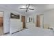 Main bedroom with white dresser, ceiling fan, and striped bedding at 6971 Lynx Dr, Nineveh, IN 46164