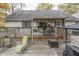 Spacious back deck with seating area, and wooded view at 6971 Lynx Dr, Nineveh, IN 46164