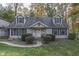Two-story home with gray siding, gray shutters, and a landscaped yard at 6971 Lynx Dr, Nineveh, IN 46164