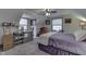 Spacious bedroom with a desk, comfy chair, and large bed at 6971 Lynx Dr, Nineveh, IN 46164