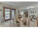 Bright dining area with wooden table and access to the deck at 6971 Lynx Dr, Nineveh, IN 46164