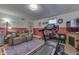 Finished basement features a home gym with treadmill, weights, and exercise bike at 6971 Lynx Dr, Nineveh, IN 46164