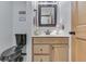 Clean bathroom with wood vanity and black toilet at 6971 Lynx Dr, Nineveh, IN 46164