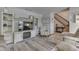 Spacious living room with a built-in entertainment center and hardwood floors at 6971 Lynx Dr, Nineveh, IN 46164