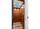 Private home elevator with wood paneling and modern controls at 860 Chatham Hills Blvd, Westfield, IN 46074