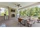 Covered patio with outdoor kitchen, fireplace, and dining area at 860 Chatham Hills Blvd, Westfield, IN 46074