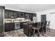 Modern basement bar with dark cabinetry and granite countertops at 860 Chatham Hills Blvd, Westfield, IN 46074
