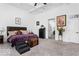 Bright bedroom with king-size bed, and access to the hallway at 860 Chatham Hills Blvd, Westfield, IN 46074