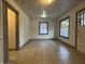 Bright living room with tile floors and large windows at 1604 W 11Th St, Anderson, IN 46016