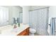 Clean bathroom with single sink vanity, shower/tub combo, and updated fixtures at 3518 Heathcliff Ct, Westfield, IN 46074
