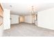 Bright dining area with chandelier and adjacent living room at 3518 Heathcliff Ct, Westfield, IN 46074