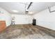Spacious garage with overhead door and ample storage space at 3518 Heathcliff Ct, Westfield, IN 46074