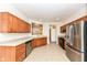 Kitchen boasts wood cabinets, tile floors and stainless steel appliances at 3518 Heathcliff Ct, Westfield, IN 46074