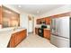 Modern kitchen with stainless steel appliances and wood cabinets at 3518 Heathcliff Ct, Westfield, IN 46074