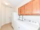 Laundry room with washer, dryer, and upper cabinets at 3518 Heathcliff Ct, Westfield, IN 46074