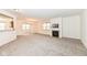 Spacious living room with carpeting, fireplace, and views to kitchen and dining areas at 3518 Heathcliff Ct, Westfield, IN 46074