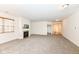 Spacious living room with carpeting, fireplace, and views to entryway at 3518 Heathcliff Ct, Westfield, IN 46074