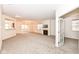 Spacious living room with carpeting, fireplace, and views to kitchen and dining areas at 3518 Heathcliff Ct, Westfield, IN 46074