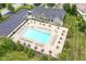 Community pool with plenty of lounge chairs and tables for relaxation at 3518 Heathcliff Ct, Westfield, IN 46074