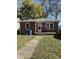 Brick ranch home with a front porch and well-maintained lawn at 4529 Crittenden Ave, Indianapolis, IN 46205