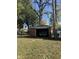 Detached brick garage with a large door and ample space at 4529 Crittenden Ave, Indianapolis, IN 46205