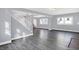 Spacious living area with hardwood floors and staircase at 3616 N College Ave, Indianapolis, IN 46205