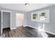 Bright bedroom with grey walls, wood-look flooring, and a closet at 3616 N College Ave, Indianapolis, IN 46205