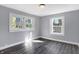 Well-lit bedroom featuring grey walls and dark grey flooring at 3616 N College Ave, Indianapolis, IN 46205