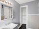 Bathroom with grey walls, a vanity, and linen closet at 3616 N College Ave, Indianapolis, IN 46205