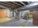 Unfinished basement with high ceilings and storage at 3616 N College Ave, Indianapolis, IN 46205