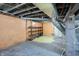 Unfinished basement with shelving unit at 3616 N College Ave, Indianapolis, IN 46205