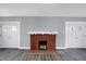 Living room with fireplace and hardwood floors at 3616 N College Ave, Indianapolis, IN 46205