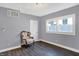 Serene bedroom with hardwood floors and large windows at 3616 N College Ave, Indianapolis, IN 46205